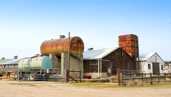 Farm buildings with pressure vessels and a storage silo